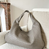 Add a touch of elegance and style to your outfit with this trendy grey woven shoulder bag for women. This dumpling oversized purse is a must-have accessory for any fashion-forward individual, perfect for work (fits small laptop) or travelling. Bottega veneta designer dupe bag by pattybofficial lifestyle store