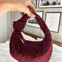 Looking for the perfect birthday gift for her? Look no further than this luxurious top handle clutch made from vegan suede. This knot bag is the perfect accessory for summer parties or everyday use famous designer inspired suede bag pattyofficial